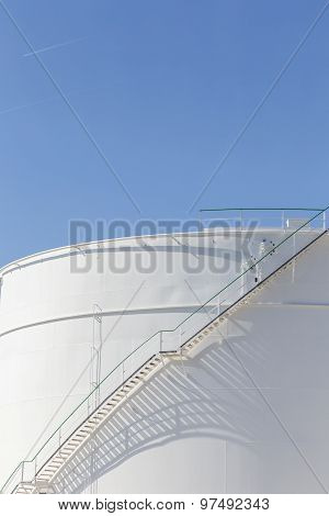 White Tanks In Tank Farm With Iron Staircase