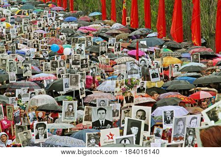 Volgograd Russia - May 9 2015: Procession of local people with photos of their relatives in Immortal Regiment on annual Victory Day on Mamaev Hill in Volgograd