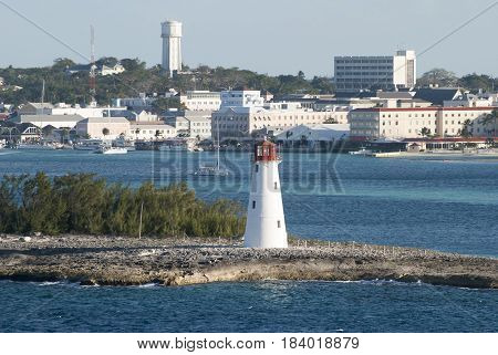 The view of a lighthouse built on Paradise Island with Nassau downtown in a background (Bahamas).