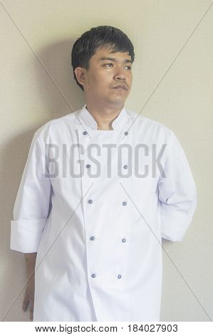 Chef portrait Asian young chef crossing arms.