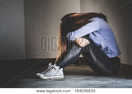 Sad Woman Sitting Alone In A Empty Room. Sressful Concept.