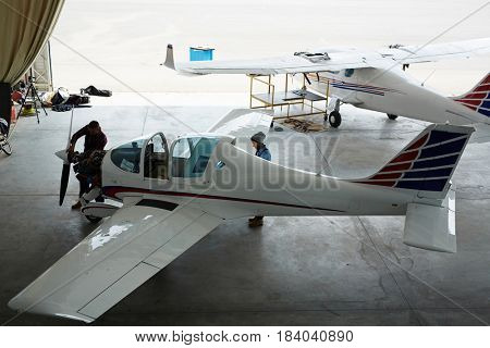 Wide angle shot of jet planes repair in maintenance hangar