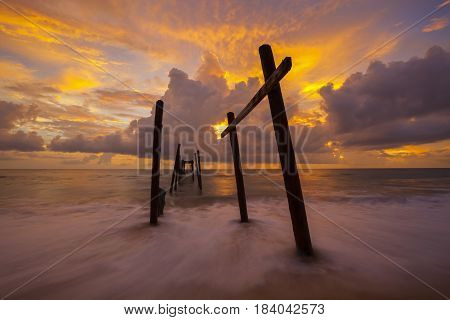 Beautiful sunset with old wooden bridge at Khao Pilai in Phang- Nga Thailand