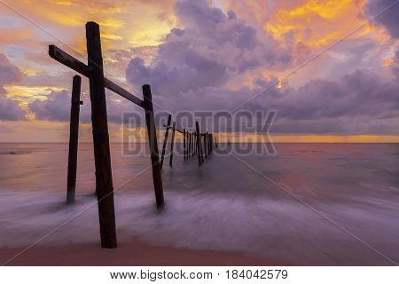Beautiful sunset with old wooden bridge at Khao Pilai in Phang- Nga Thailand