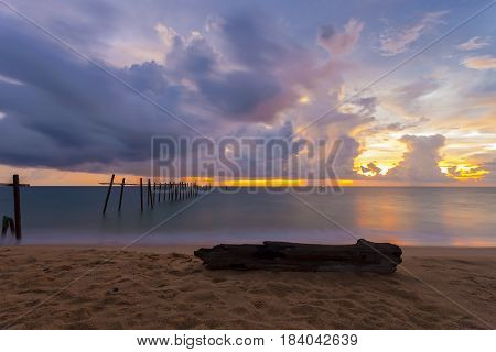 Beautiful sunset with old wooden bridge at Khao Pilai in Phang- Nga Thailand