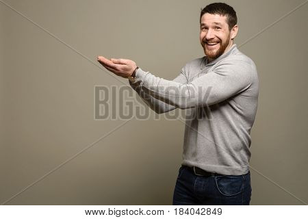 Young Man Presenting. Copy Space For Your Text