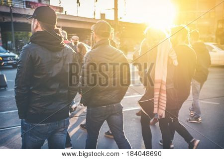 Group Of Young People Walking On Street