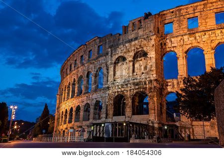 Pula amphitheatre during the morning blue hour from the outside