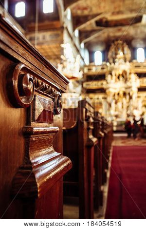 Detail shot of the carvings at the end of the seating benches in the church of Peace in Swidnica Silesia Poland.