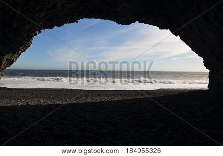 Looking out of a cavern on Reynisfjara beach in southern Iceland.