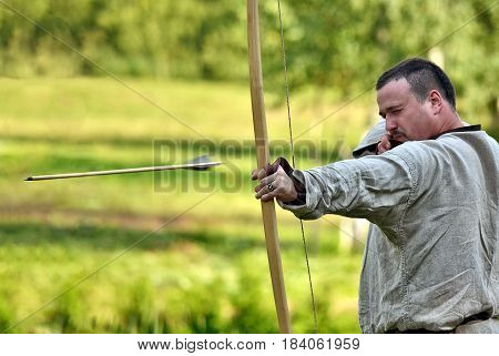 TERVETE LATVIA - AUGUST 13 2011: Historical Zemgalu days. Unknown archer demonstrate his skill.