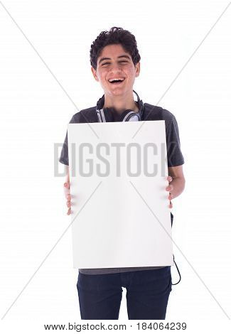 Portrait of smiley happy friendly young student holding an empty blank board teenager wearing gray t-shirt and jeans with a headphone and backbag isolated white background