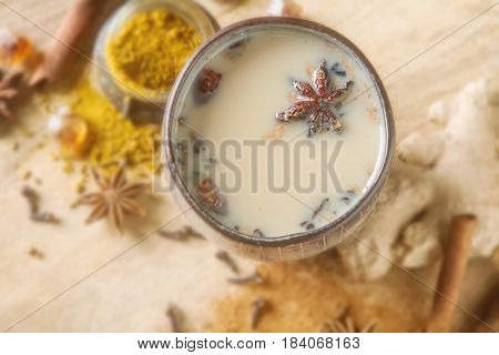 Traditional Indian Masala Tea In Ceramic Cup With Spices To Milk