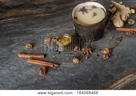 Traditional Indian Masala Tea In Ceramic Cup With Spices To Milk