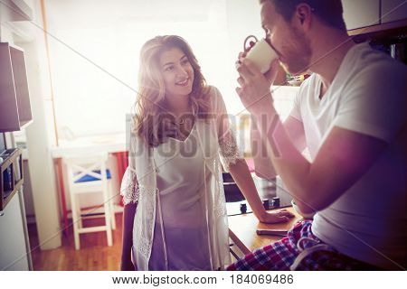 Romantic couple in love speding time together in kitchen