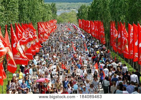 Volgograd Russia - May 9 2016: Procession of local people with photos of their relatives in Immortal Regiment on annual Victory Day on Mamaev Hill in Volgograd