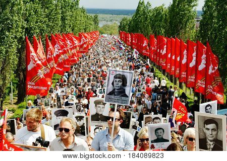 Volgograd Russia - May 9 2016: Procession of local people with photos of their relatives in Immortal Regiment on annual Victory Day on Mamaev Hill in Volgograd