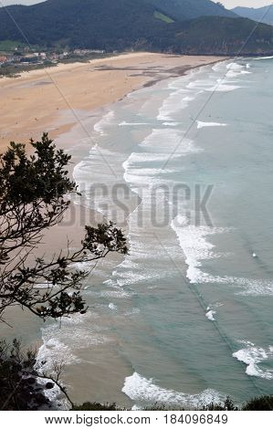 Beach and village of Berria from Mount Buciero, Santoña, Cantabria, Spain