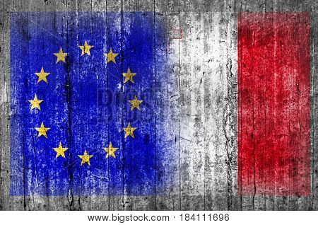 EU and Malta flag on concrete wall