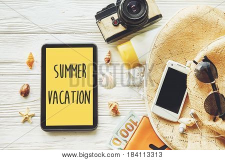 Summer Vacation Text Sign On Yellow Tablet Screen. Planning Summer Holiday Flat Lay, Camera Sunglass