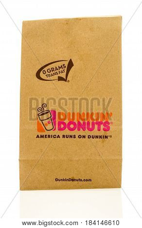 Winneconne WI - 23 April 2017: A Dunkin Donuts paper bag on an isolated background.