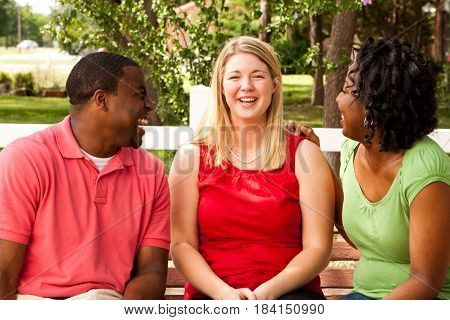 Happy commuinity group of people talking and laughing.