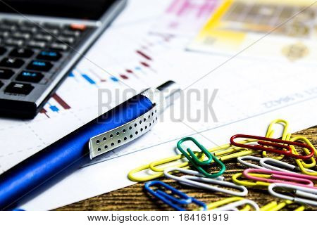 calculatorpencil and money on graffica the Dow Jones on forex market
