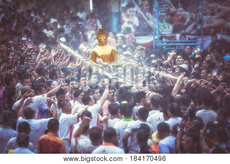NONGKHAI THAILAND APRIL 13: Songkran Festival The people pour water and join parade of the statue of Luang Pho Phra Sai with respect to faith on April 13-18 2017 in Nongkhai Thailand.