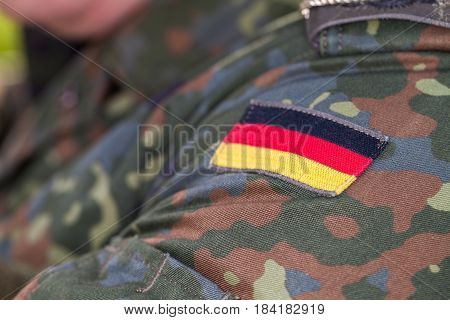 a german flag on german army uniform