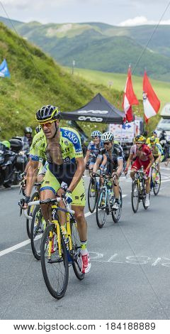 Col de PeyresourdeFrance- July 23 2014: The Italian cyclist Matteo Tosatto of Tinkoff-Saxo Team riding in the peloton on the road to Col de Peyresourde in Pyrenees Mountains during the stage 17 of Le Tour de France on 23 July 2014.