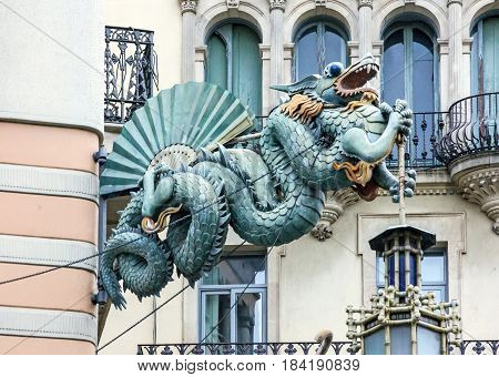 Barcelona. Chinese dragon on House of Umbrellas (Casa Bruno Cuadros) building on La Rambla. Catalonia, Spain.