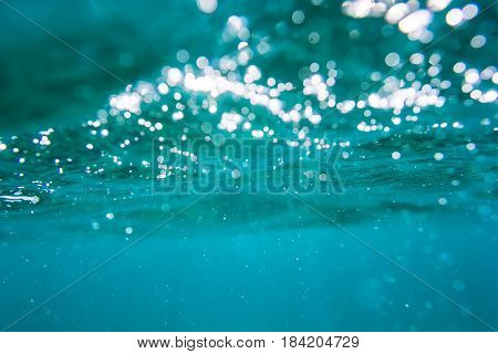 Water bubbles in underwater in blue ocean. Water texture.