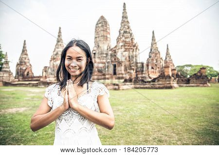 Young woman praying at Ayutthaya Historical Park