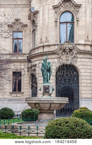 Fountain on the background the facade of Metropolitan Ervin Szabo Library is the largest library network in Budapest Hungary.