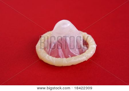 Condom on a red background