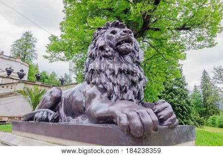 Sculpture of lion in park near Linderhof Palace. Germany southwest Bavaria.