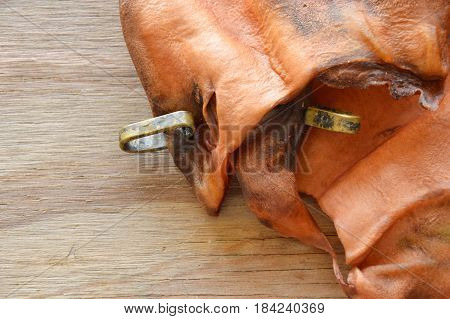 pet snack dried ear cow with loop made from real meat on wooden board