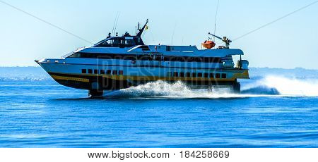 hydrofoil boat runs at full speed on the sea waves