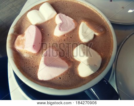 Cocoa with marshmallow. Hot chocolate with heart shaped marshmellow sweets. Romantic drink, hot beverage
