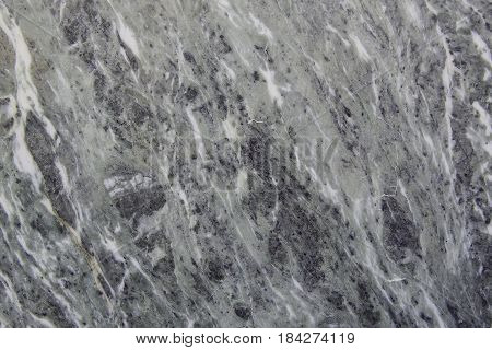 Photo of a homogeneous texture of polished white granite