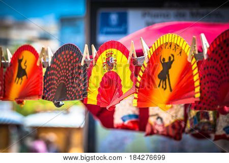 Colorful Spanish Fans arranged for sale in a store