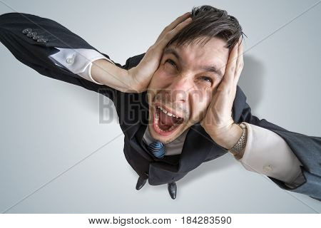Young Schizophrenic Man Suffers From Headache And Covering His E