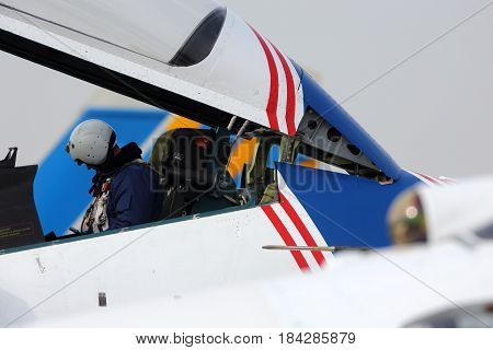 KUBINKA, MOSCOW REGION, RUSSIA - APRIL 21, 2017: Pilot of Sukhoi Su-30SM 32 BLUE Russian Knights aerobatics team of Russian air force during Victory Day parade rehearsal at Kubinka air force base.