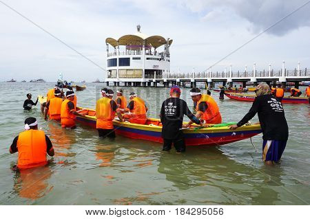 Labuan,Malaysia-April 29,2017:Group of boatman with life jacket participate in a boat tug of war games in Labuan International Sea Sports Complex at Labuan,Malaysia on 29th April 2017.