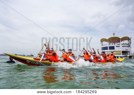 Labuan,Malaysia-April 29,2017:Group of boatman with life jacket participate in a boat tug of war games in Labuan International Sea Sports Complex at Labuan,Malaysia on 29th April 2017.