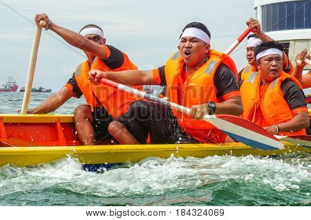 Labuan,Malaysia-April 29,2017:Group of boatman with life jacket participate in a boat tug of war games in Labuan International Sea Sports Complex at Labuan,Malaysia on 29th April 2017.