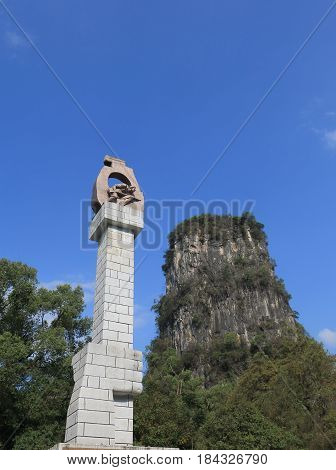 YANGSHOU CHINA - NOVEMBER 18, 2016: Yangshou park monument and karst mountian.