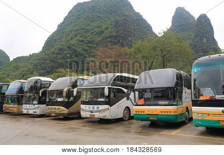 YANGSHOU CHINA - NOVEMBER 19, 2016: tour bus wait for passengers in Xingping historical village.