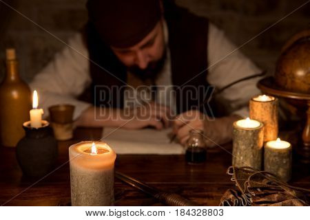 a medieval man is sign a dokument concept business and contract