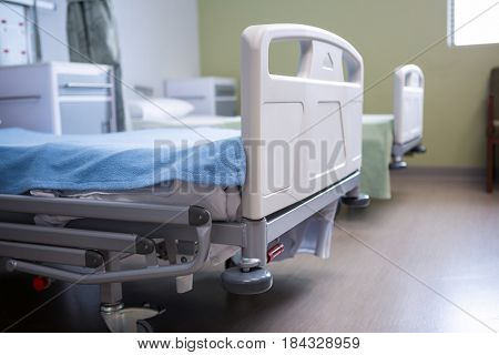 Close-up of empty beds in ward at hospital